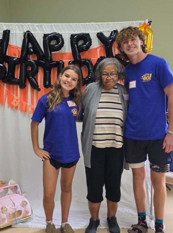 EOC client Alma with young friends