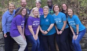 Group photo of Elder Orphan Care's board and staff